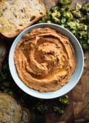 Sun-Dried Tomato Hummus and Roasted Broccoli Crostini